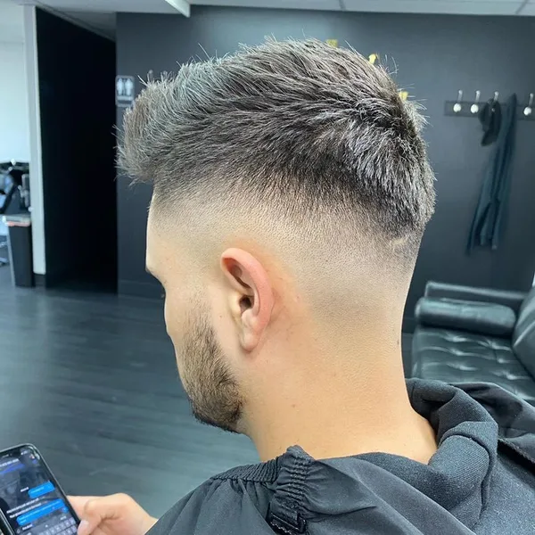 Textured quiff with a high skin fade, cut by Aldo Barragan