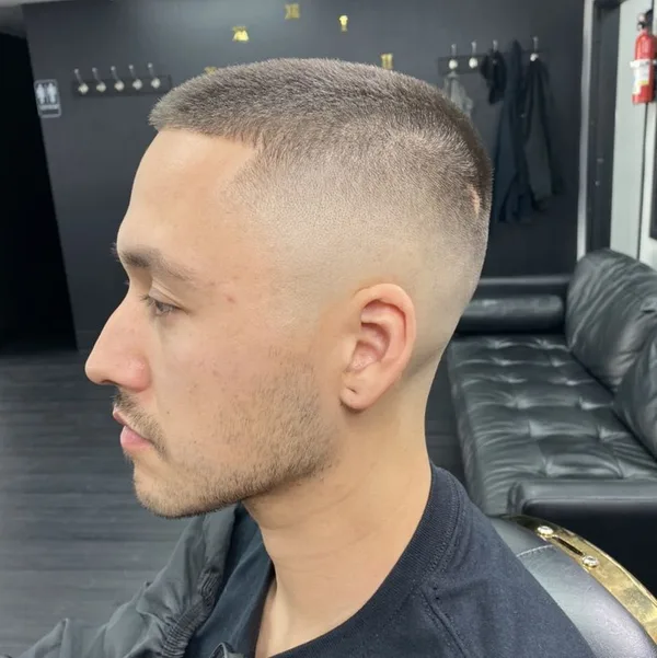 Crew cut with a crisp mid skin fade and clean lineup