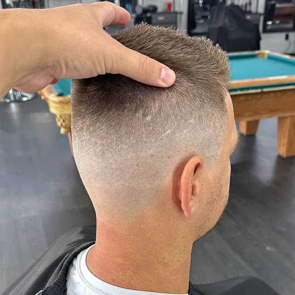 High skin fade getting its finishing touches at the chair